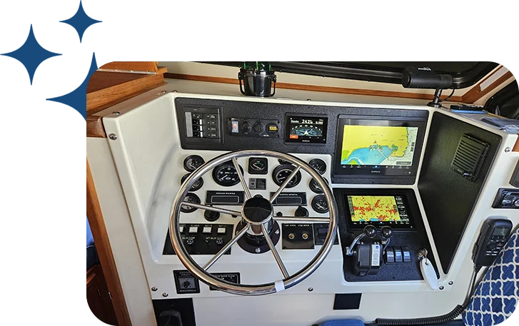 A boat with a steering wheel and some other equipment