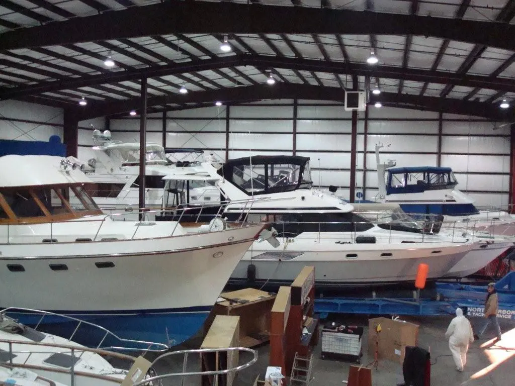 A warehouse with many boats parked in it.